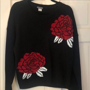 Black sweater with bold flower print